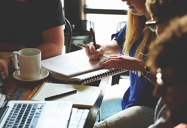 the picture shows a group of working students.